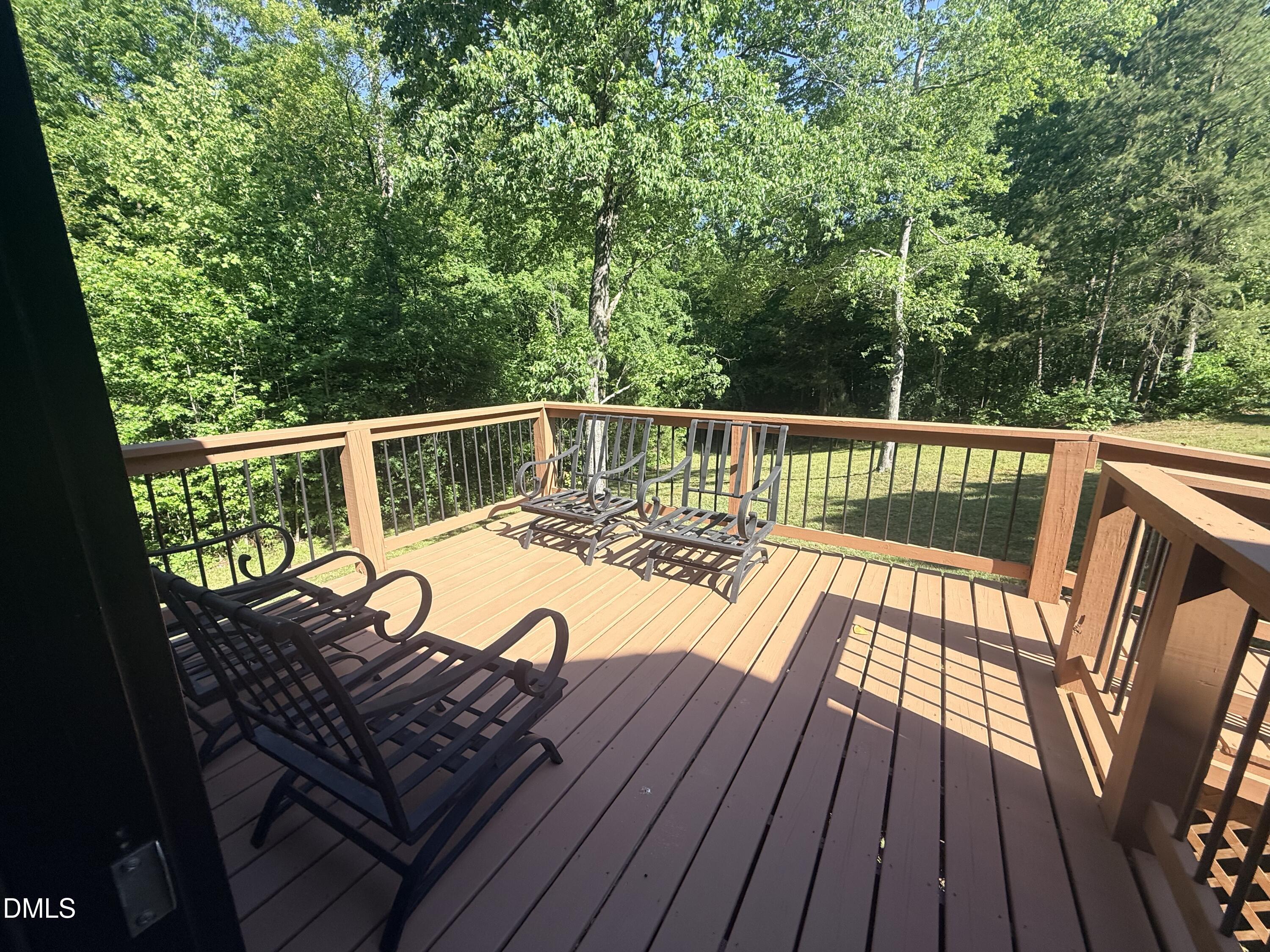 327 Shady Oak Road Roxboro, NC 27574 - Photo 20 of 62 a view of balcony with wooden floor and outdoor seating