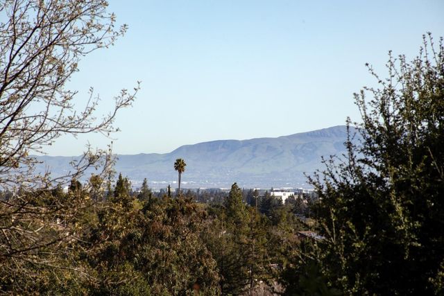 a view of a house in a field