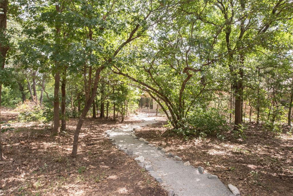 328 Wolf Front Road Van Alstyne, TX 75495 - Photo 1 of 40 Walk through the trees to get to the front door