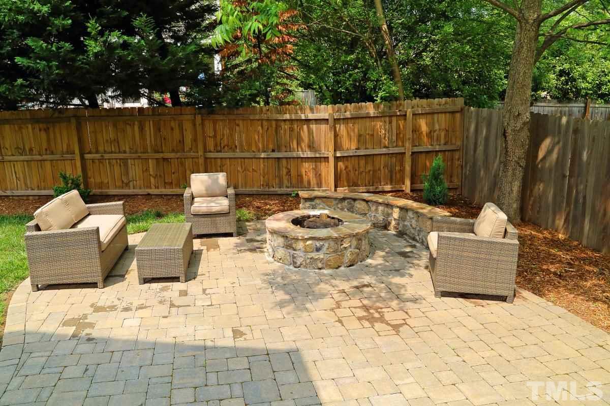 315 Georgetown Road Raleigh, NC 27608 - Photo 21 of 24 Great entertaining space, stone paver patio with built in fire pit.