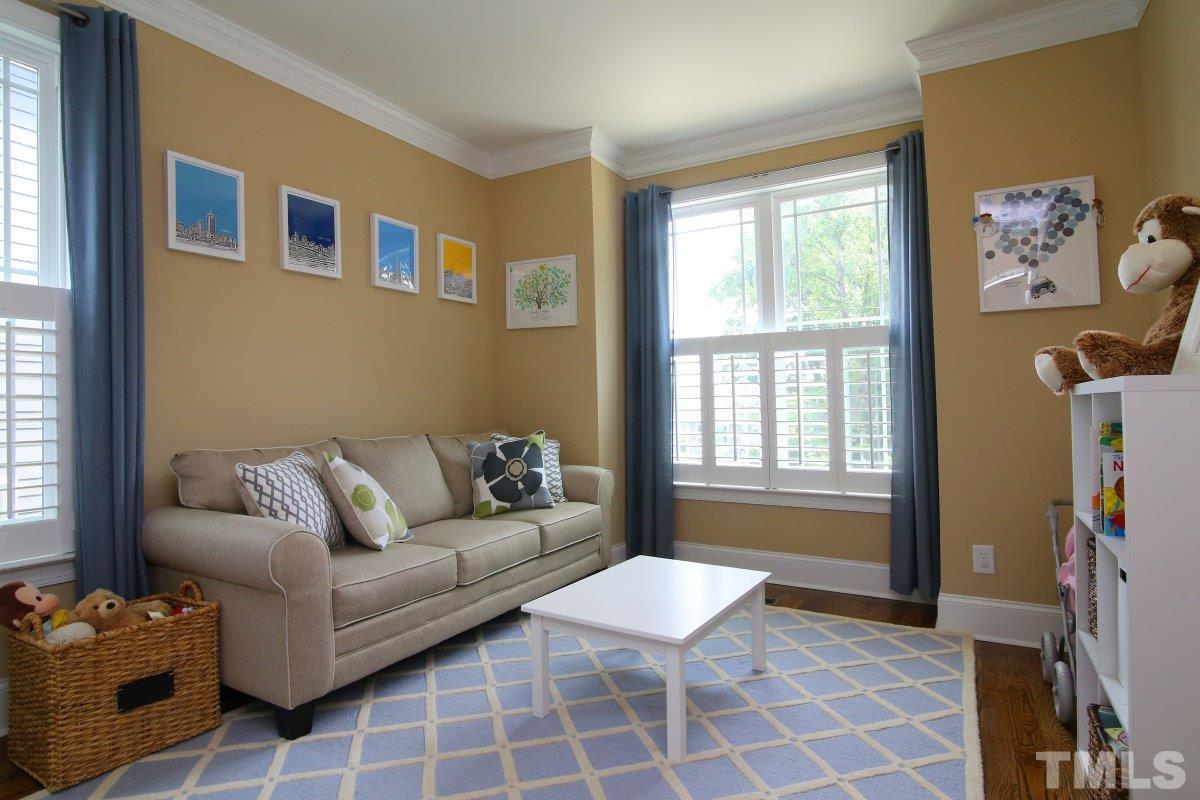 315 Georgetown Road Raleigh, NC 27608 - Photo 5 of 24 First floor bedroom (or playroom) with separate full bath.