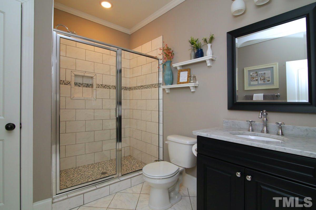 315 Georgetown Road Raleigh, NC 27608 - Photo 6 of 24 Full bath w/gorgeous tiled shower for 1st floor bedroom.
