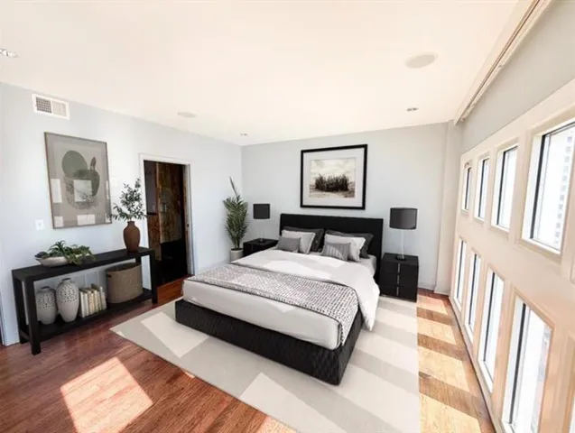 a view of a chairs and table on wooden deck with a yard