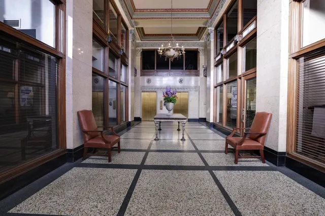 a view of a balcony with furniture