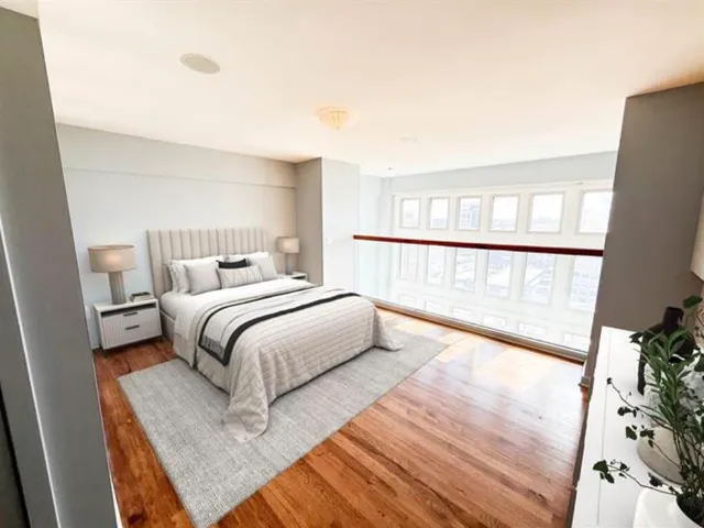 a bedroom with a bed and a fireplace