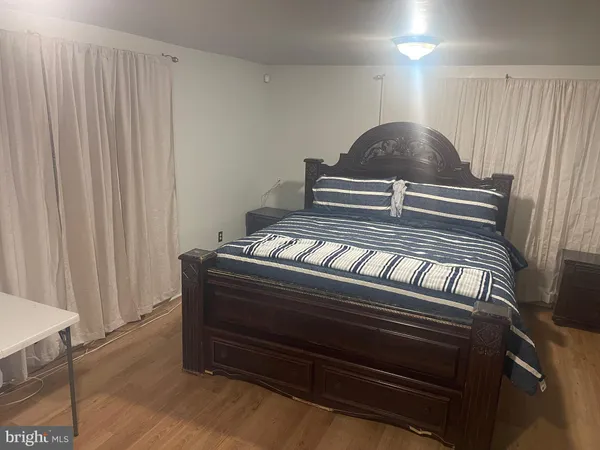 a living room with a couch and a piano