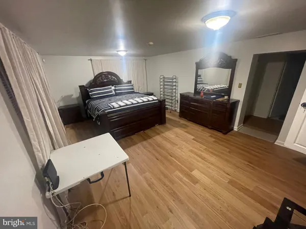 a living room with furniture and a piano