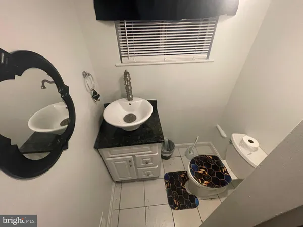 a bedroom with a bed and chair