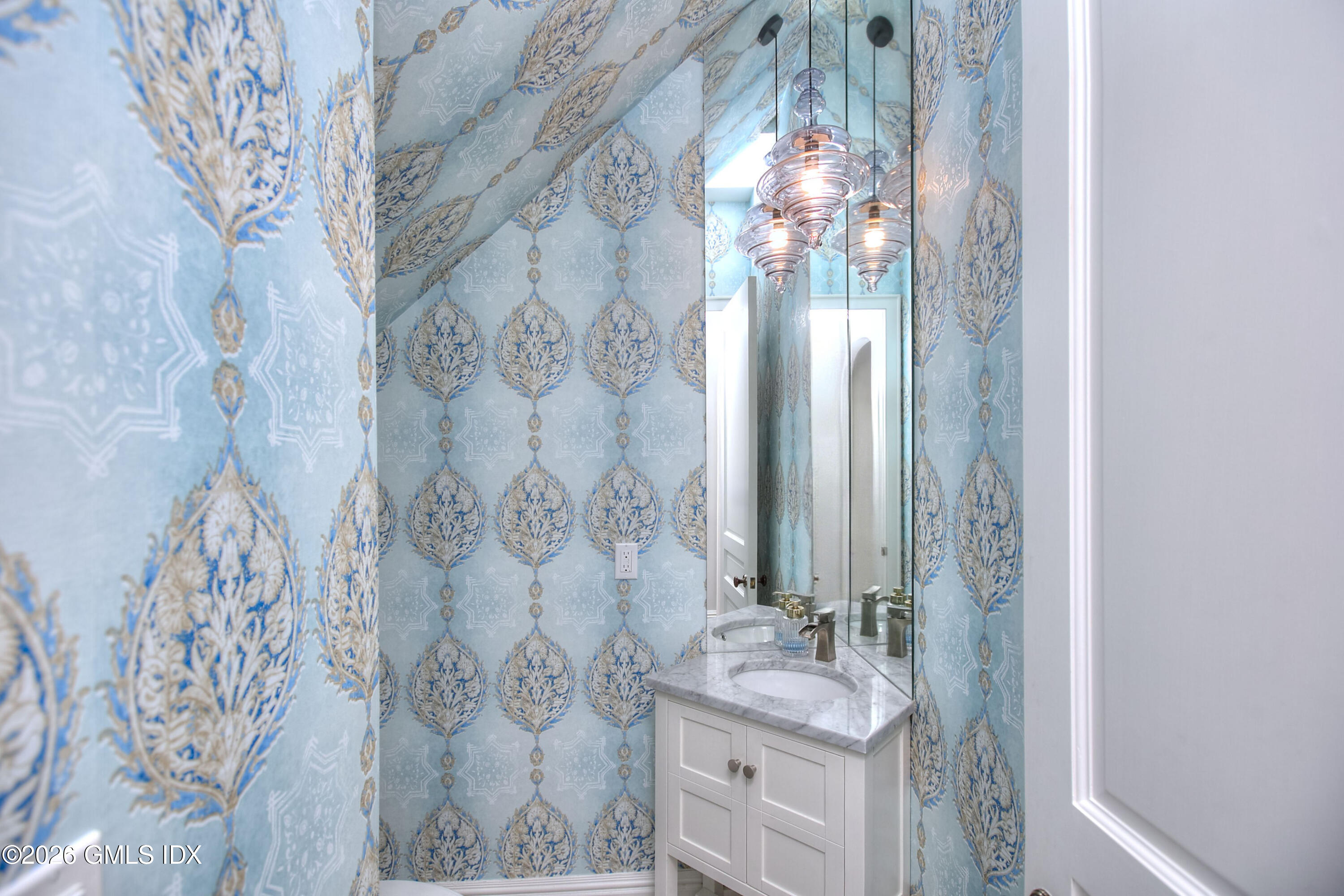 3 Shorehaven Road Norwalk, CT 06855 - Photo 10 of 40 a bathroom with a mirror sink and vanity