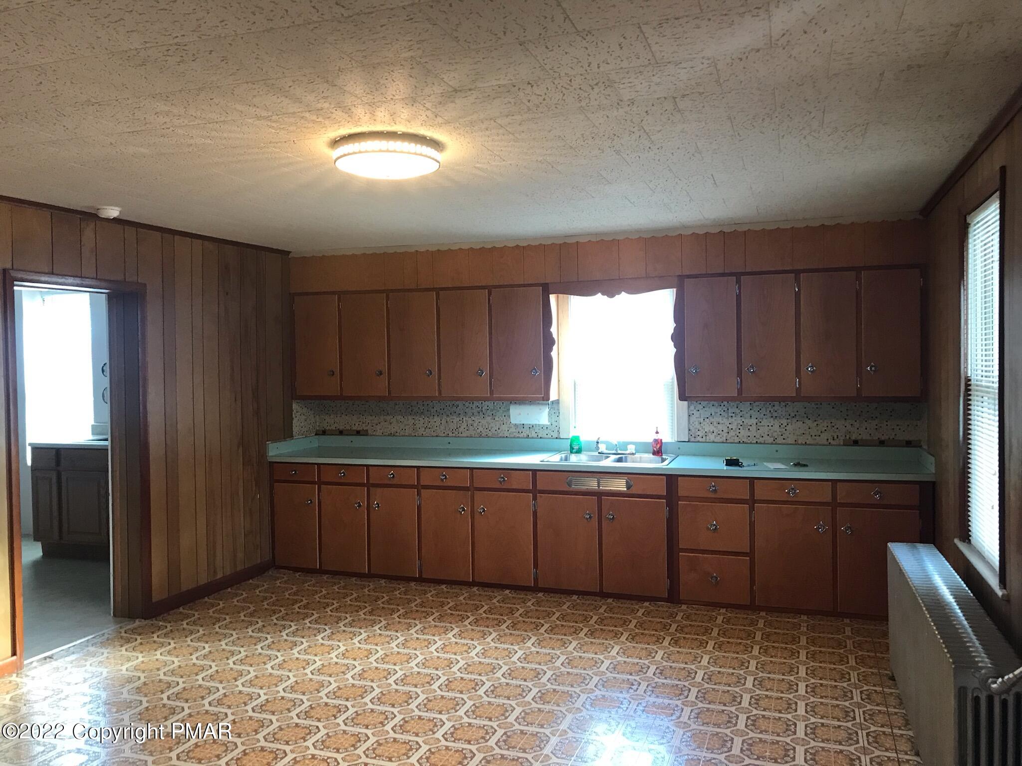51 Rhume Street Nesquehoning, PA 18240 - Photo 16 of 17 a kitchen with stainless steel appliances granite countertop a sink and cabinets
