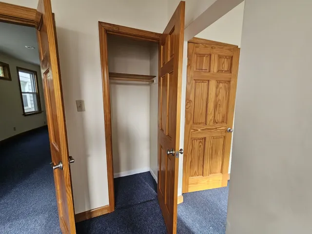 a view of front door with wooden floor