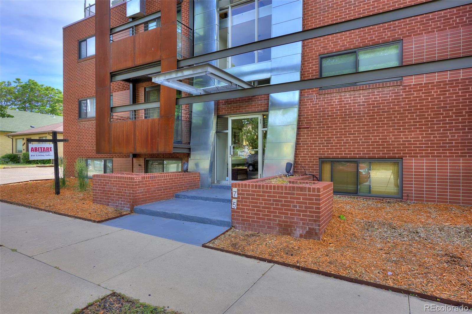 a view of a brick building with many windows