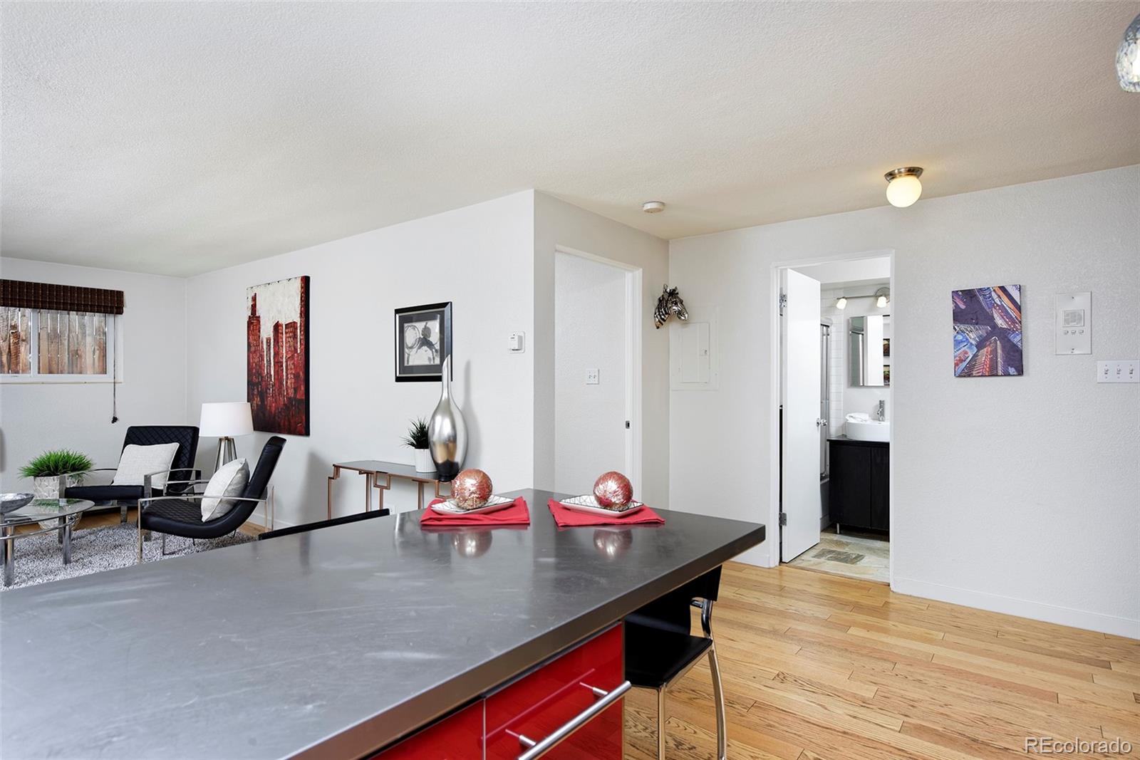 75 Emerson Street, Unit 103 Denver, CO 80218 - Photo 11 of 19 a view of a dining room with furniture