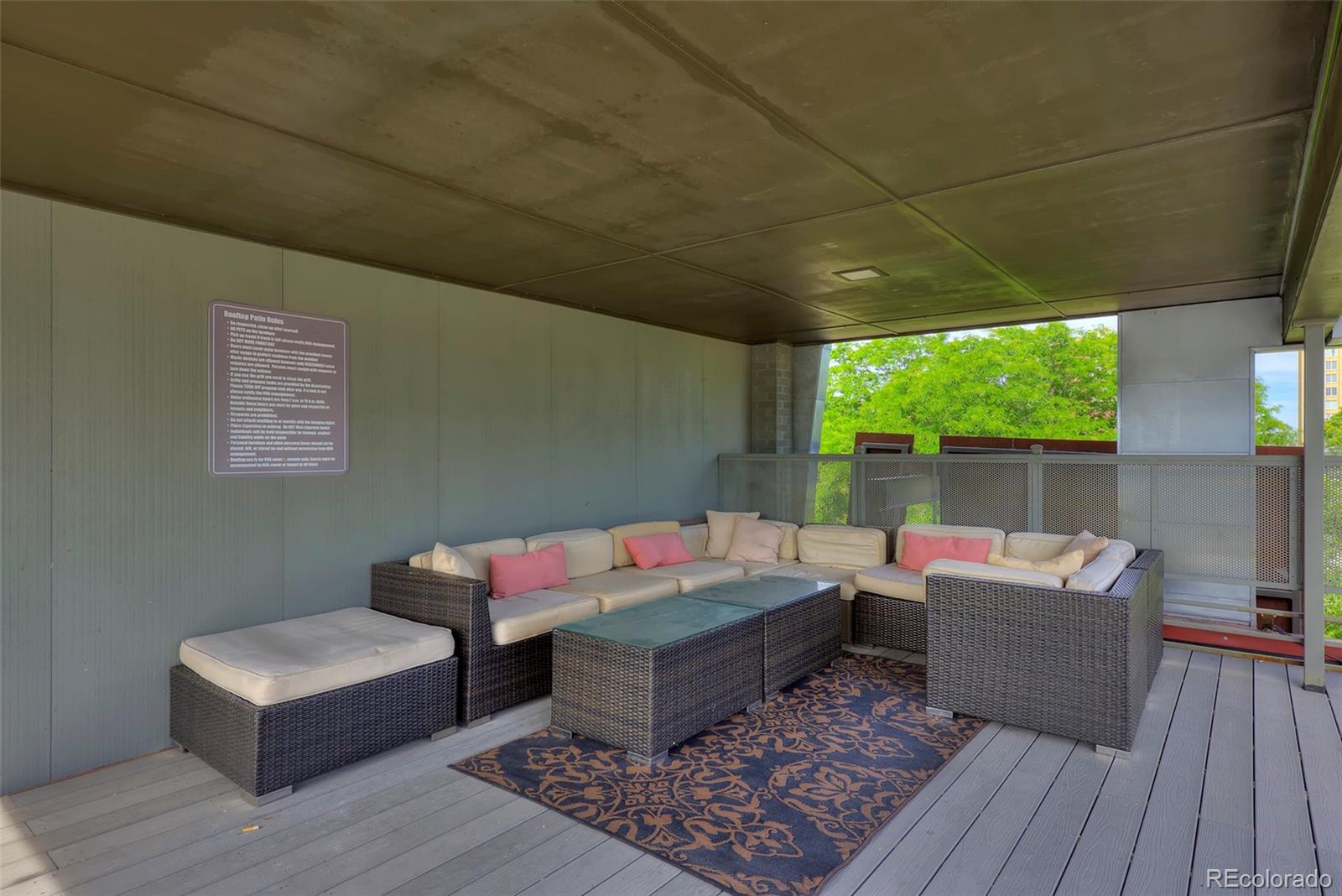75 Emerson Street, Unit 103 Denver, CO 80218 - Photo 17 of 19 a reading room with furniture and wooden floor