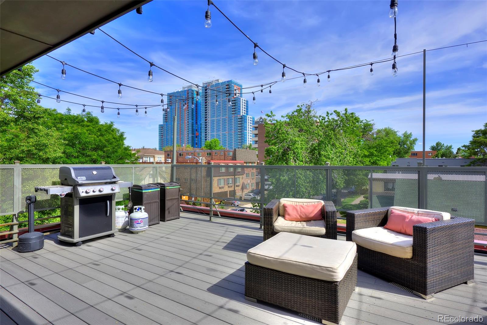 75 Emerson Street, Unit 103 Denver, CO 80218 - Photo 18 of 19 a patio with patio a couch and chairs
