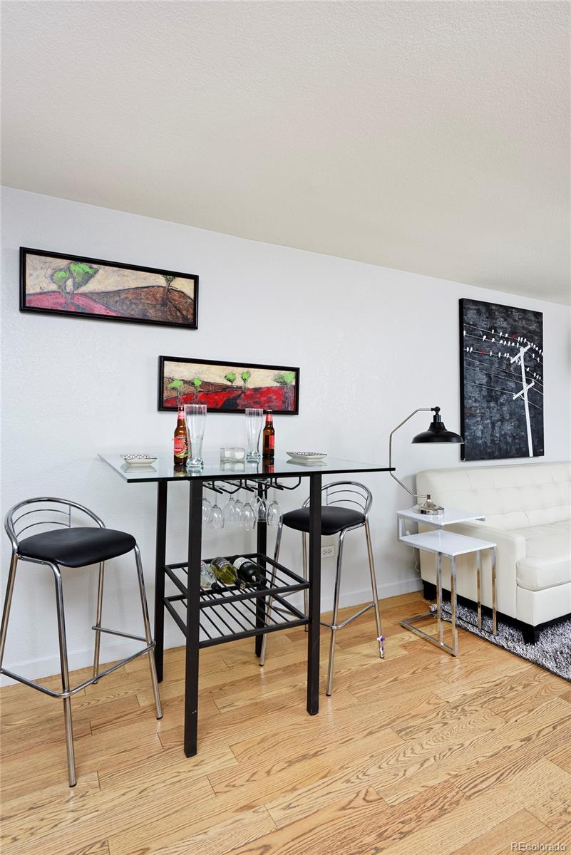 75 Emerson Street, Unit 103 Denver, CO 80218 - Photo 6 of 19 a view of a workspace with furniture and wooden floor