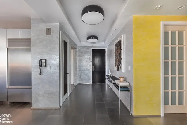 a view of a livingroom with furniture and a flat screen tv