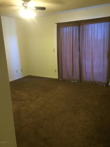 a view of room with window and stairs