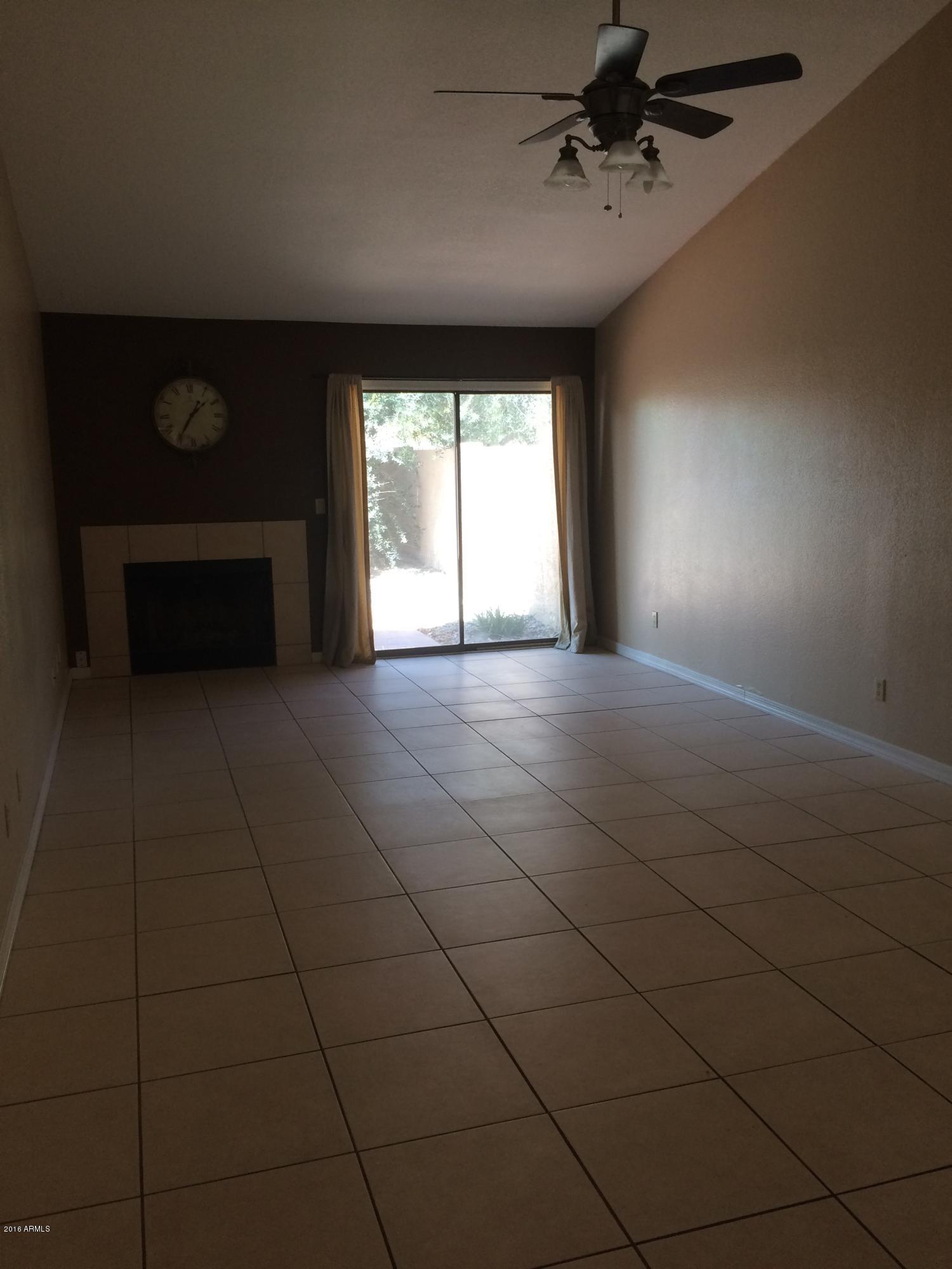 304 East Bluebell Lane Tempe, AZ 85288 - Photo 2 of 24 a view of a livingroom with a fireplace