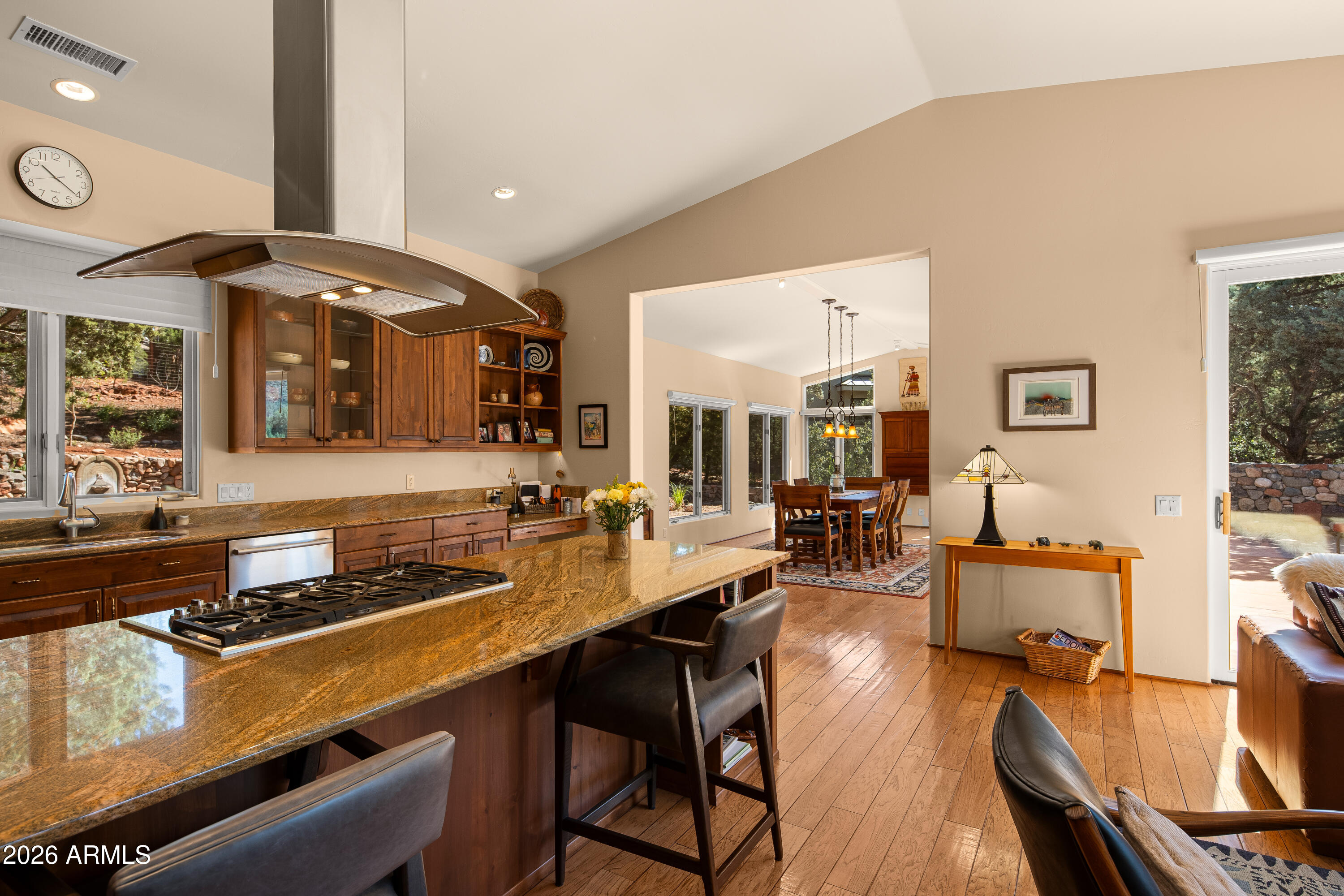 190 Morgan Road Sedona, AZ 86336 - Photo 28 of 51 a kitchen with a table chairs stove and wooden floor