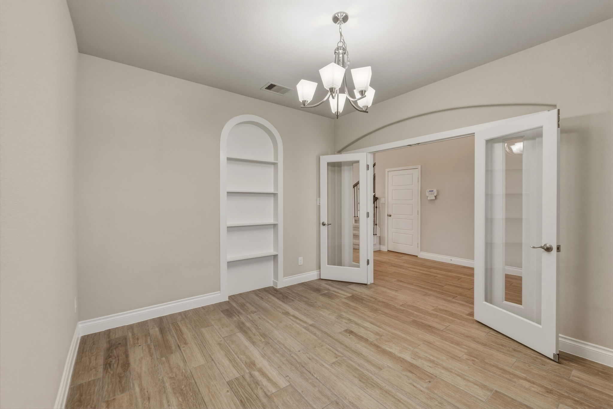 1320 Low Branch Lane Leander, TX 78641 - Photo 7 of 38 a view of an empty room with wooden floor