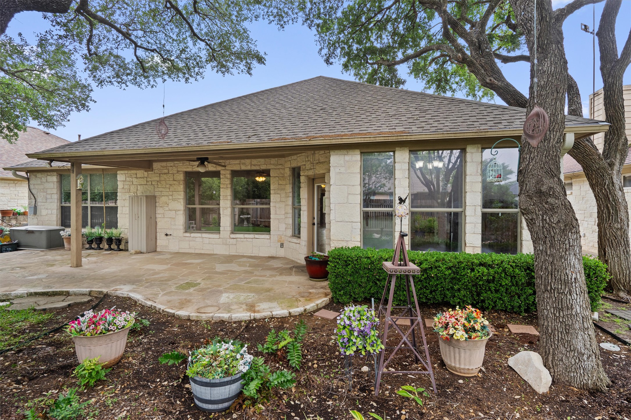 4612 Sonora Trace Georgetown, TX 78633 - Photo 33 of 36 a view of a house with a backyard and a garden