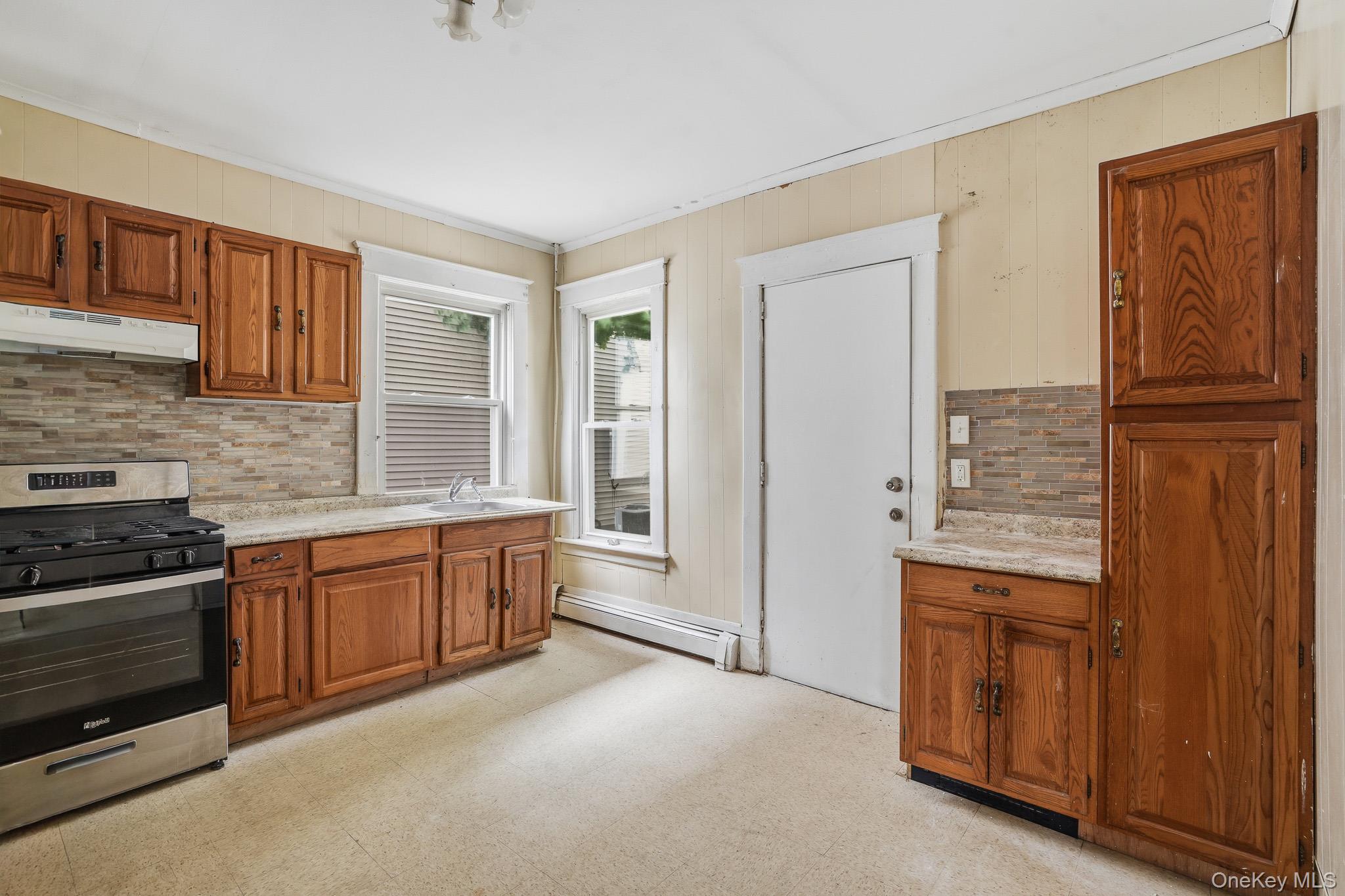 65 North Clinton Street Poughkeepsie, NY 12601 - Photo 13 of 43 a large kitchen with cabinets