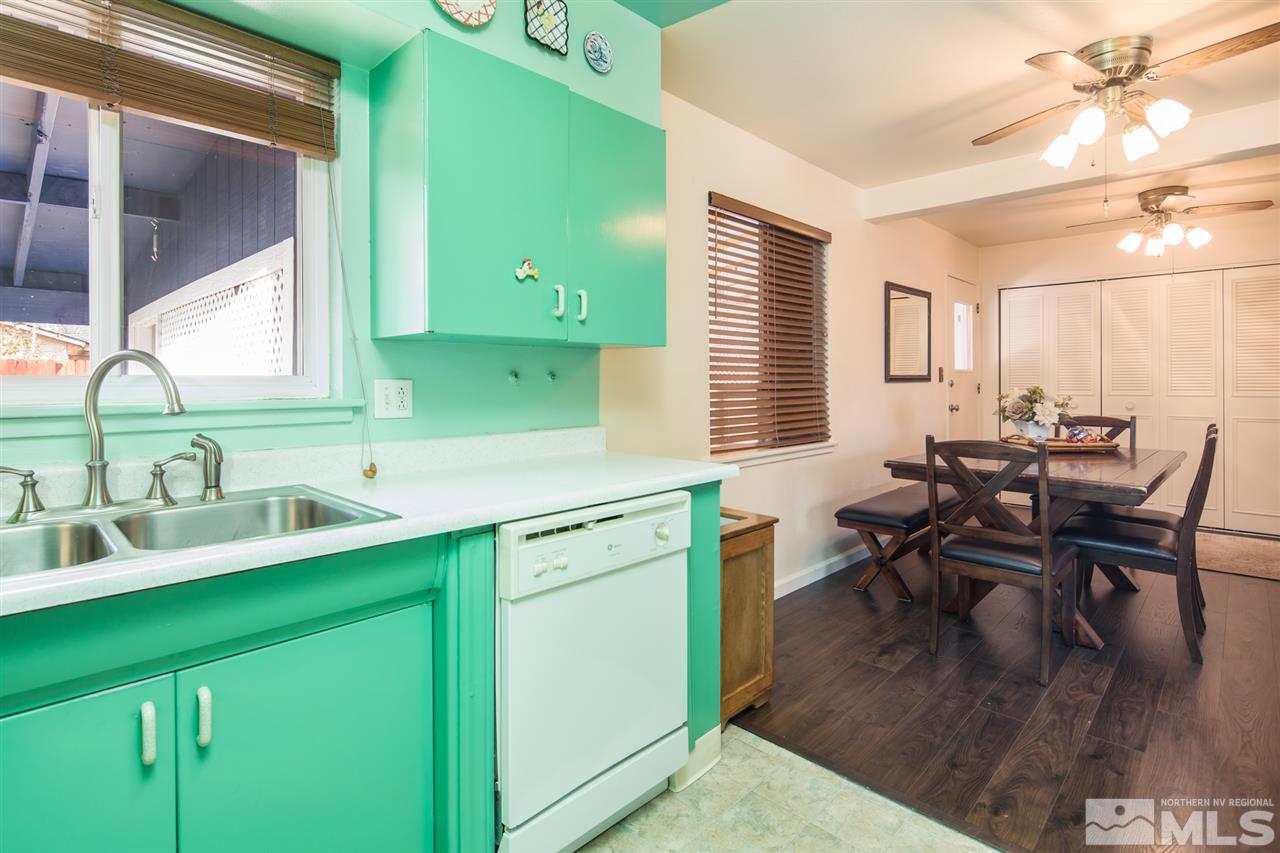 1665 Clemson Road Reno, NV 89502 - Photo 12 of 25 a kitchen with a sink cabinets and dining table chair