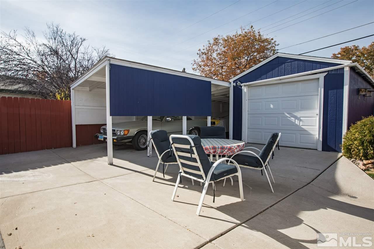 1665 Clemson Road Reno, NV 89502 - Photo 21 of 25 a patio with a table and chairs and potted plants