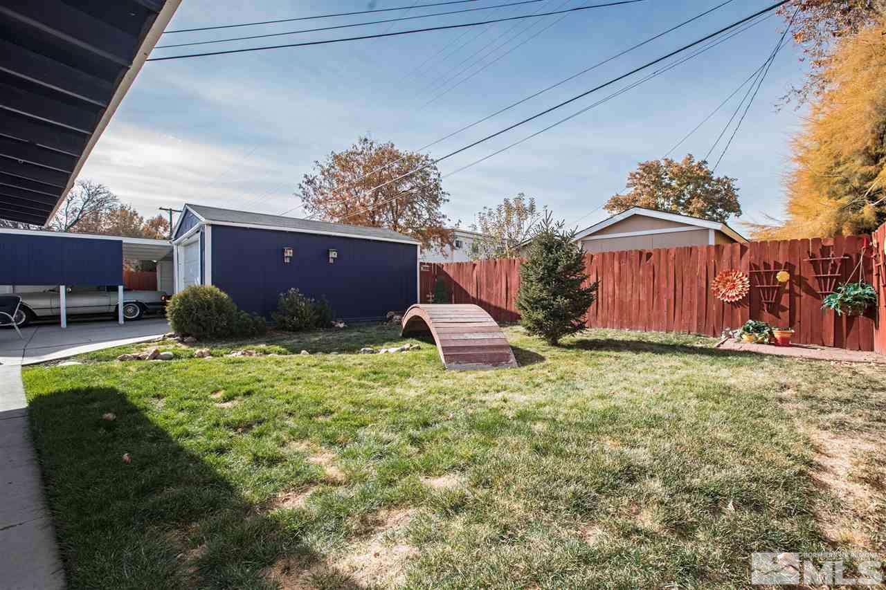 1665 Clemson Road Reno, NV 89502 - Photo 24 of 25 a backyard of a house with table and chairs
