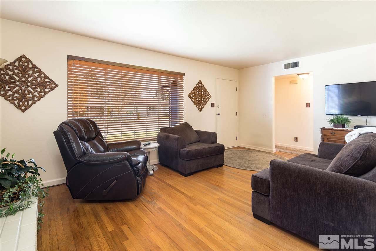 1665 Clemson Road Reno, NV 89502 - Photo 4 of 25 a living room with furniture and a flat screen tv