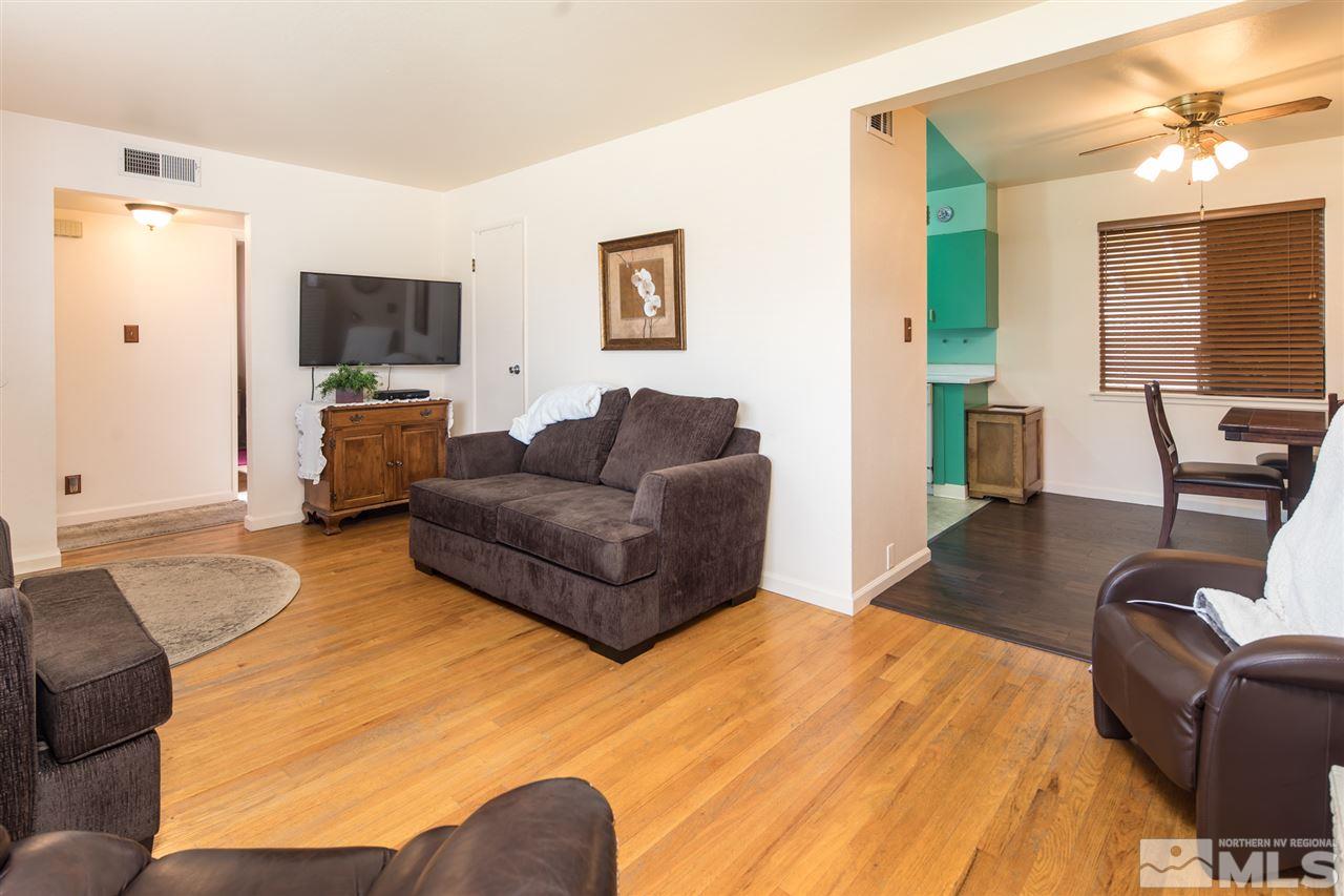 1665 Clemson Road Reno, NV 89502 - Photo 5 of 25 a bedroom with furniture and a flat screen tv