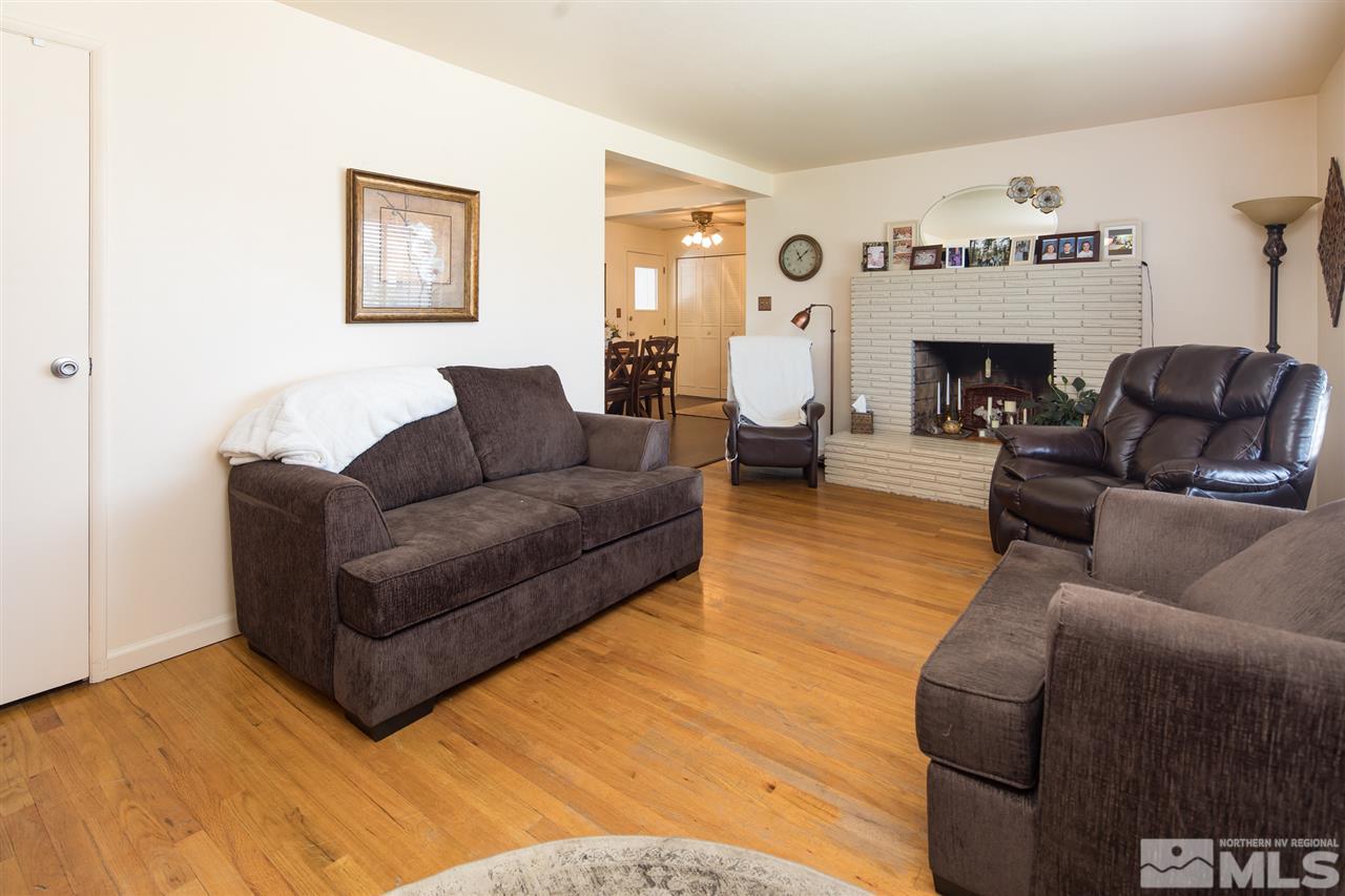 1665 Clemson Road Reno, NV 89502 - Photo 6 of 25 a living room with furniture and a fireplace