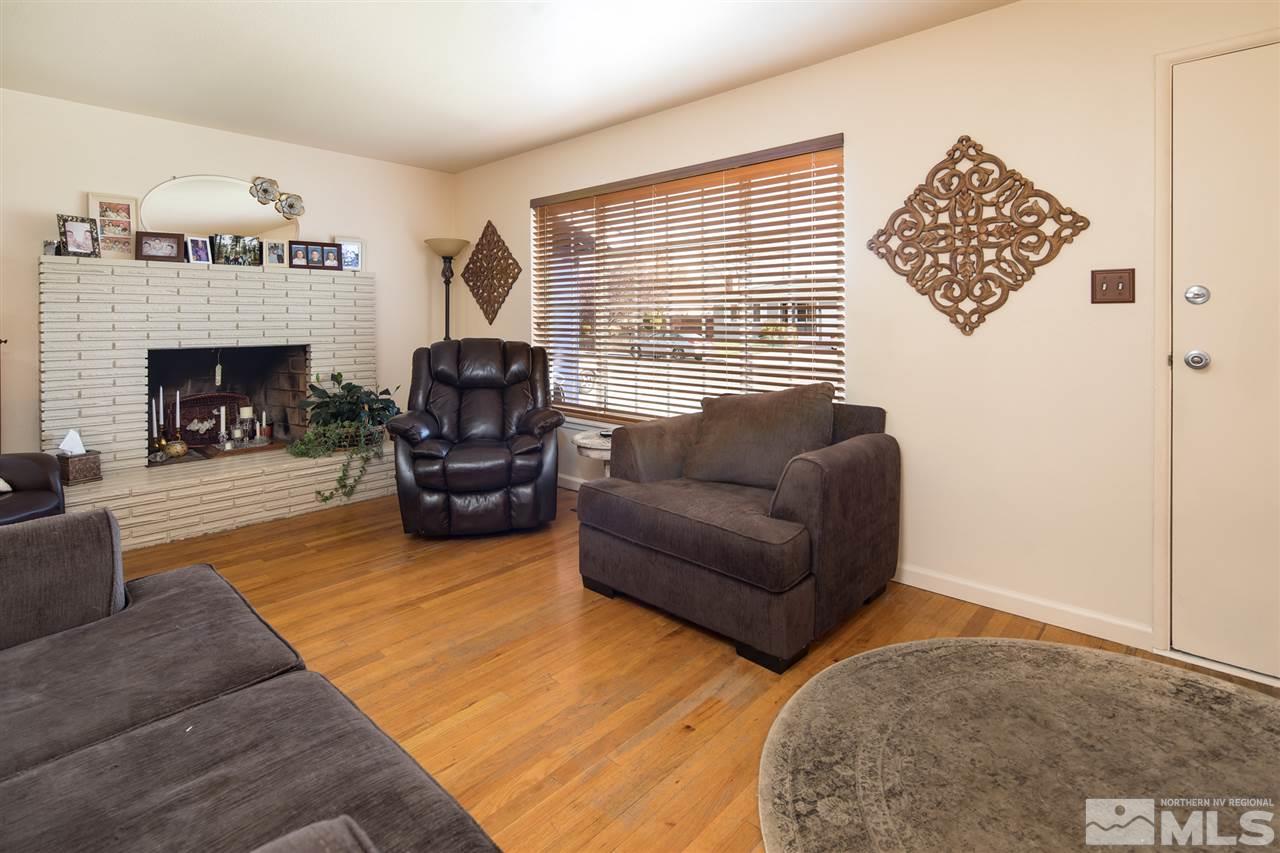 1665 Clemson Road Reno, NV 89502 - Photo 7 of 25 a living room with furniture and a fireplace