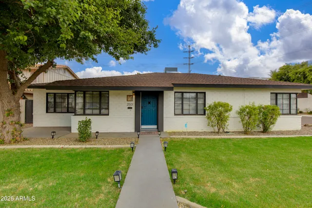 a front view of a house with garden