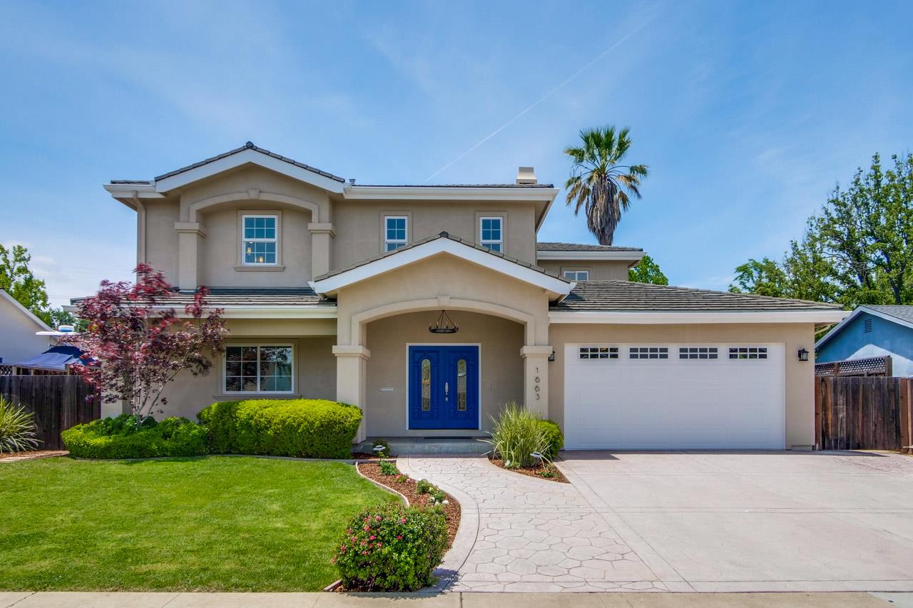 1663 Samedra Street Sunnyvale, CA 94087 - Photo 2 of 79 a front view of a house with a yard and garage