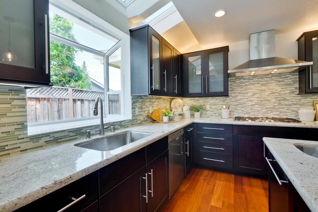1663 Samedra Street Sunnyvale, CA 94087 - Photo 21 of 79 a kitchen with stainless steel appliances granite countertop wooden cabinets a sink and dishwasher