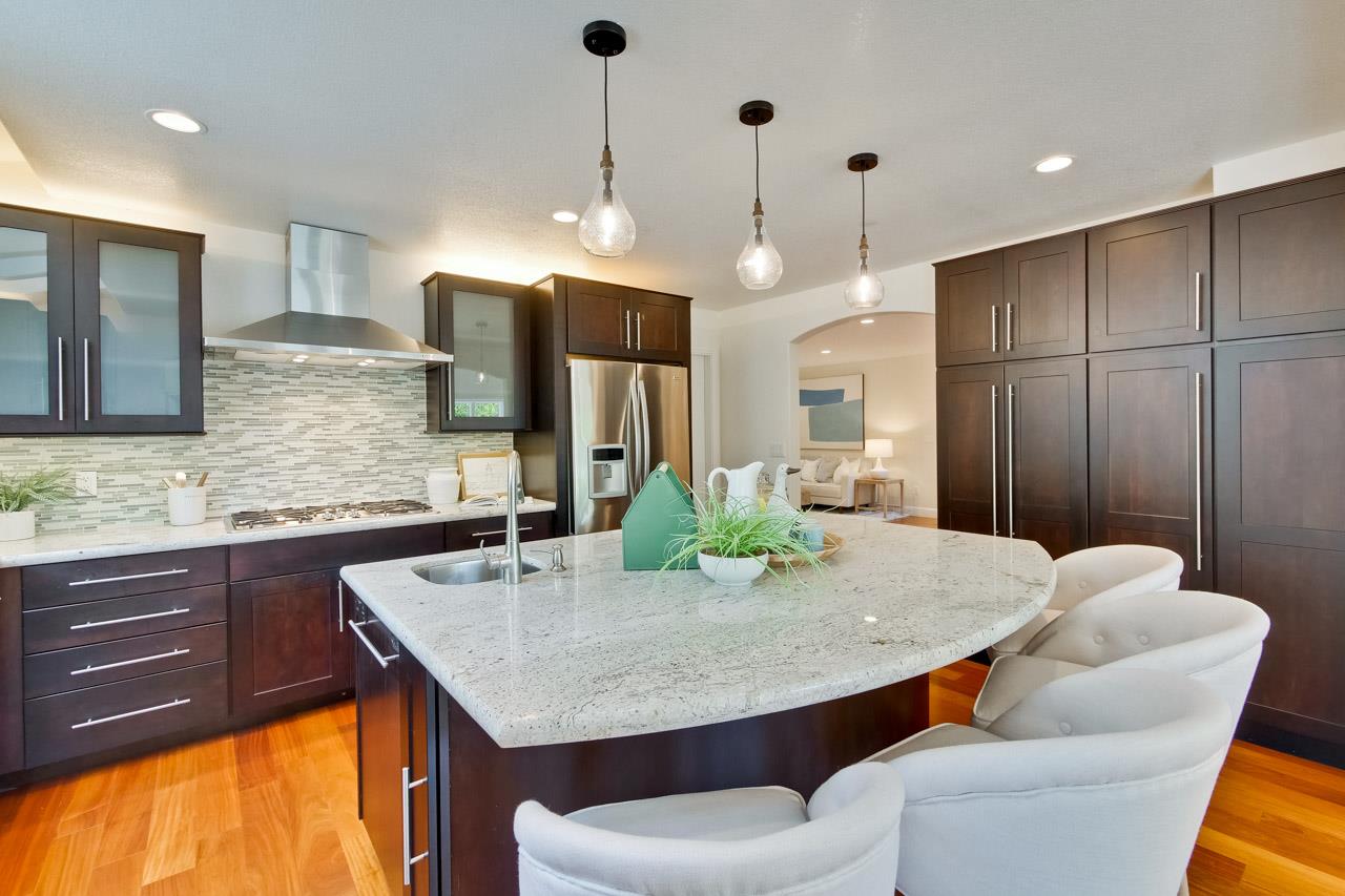 1663 Samedra Street Sunnyvale, CA 94087 - Photo 25 of 79 a kitchen with stainless steel appliances granite countertop sink microwave and dining table