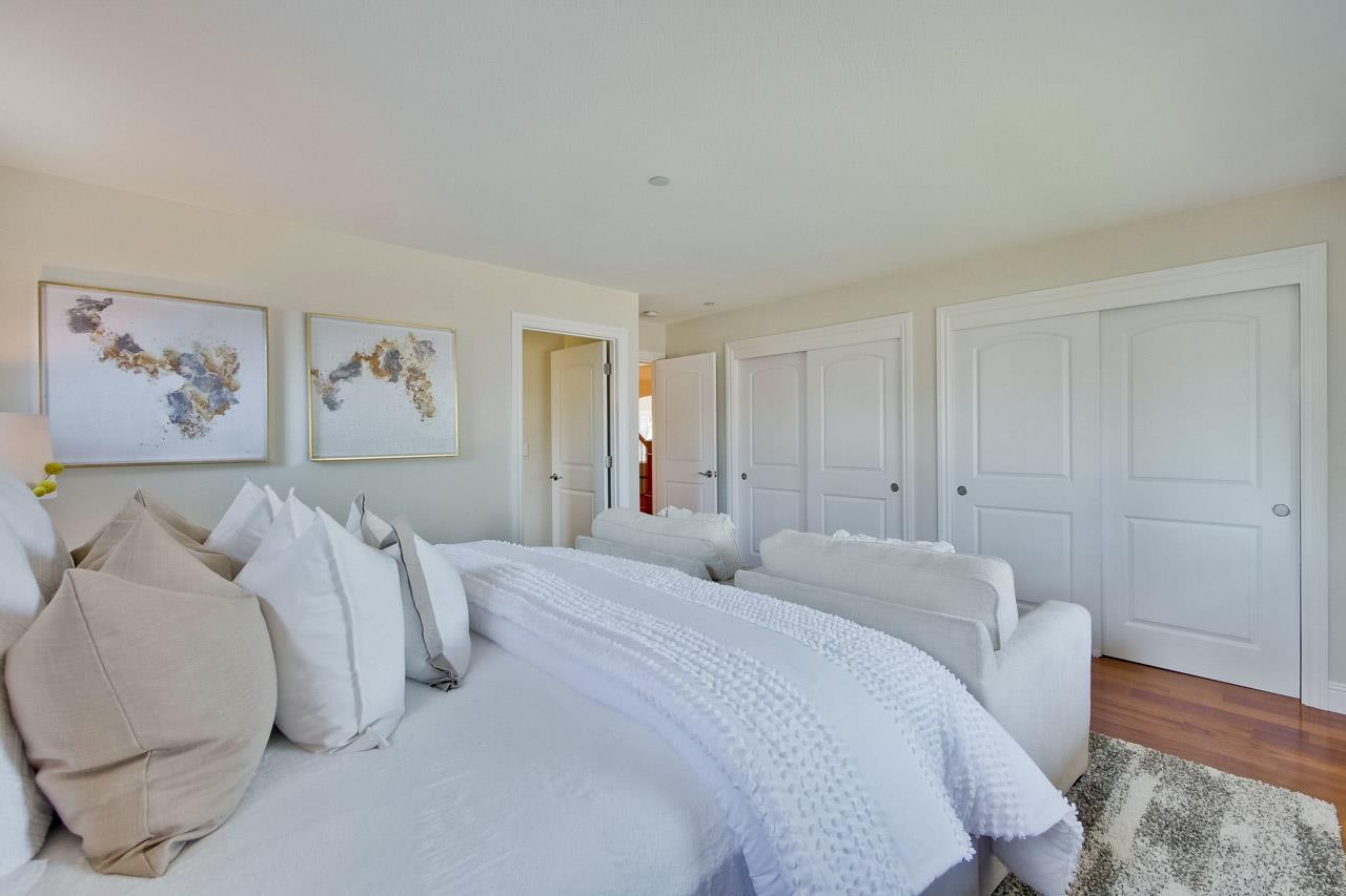 1663 Samedra Street Sunnyvale, CA 94087 - Photo 33 of 79 a bedroom with a bed and a painting on the wall