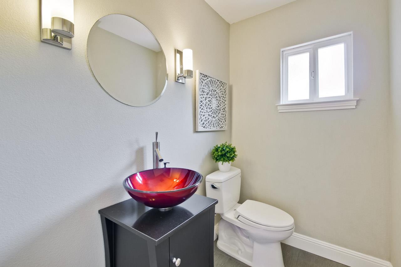 1663 Samedra Street Sunnyvale, CA 94087 - Photo 43 of 79 a bathroom with a toilet a sink and a mirror