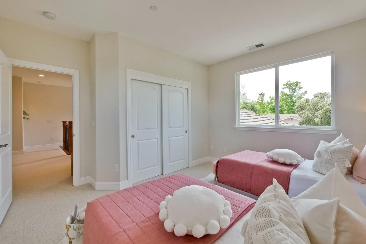 1663 Samedra Street Sunnyvale, CA 94087 - Photo 52 of 79 a bedroom with two beds and a large window