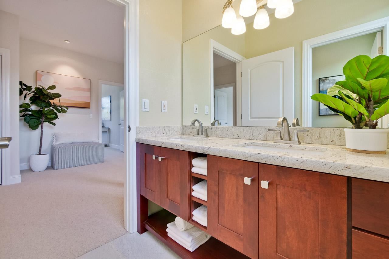 1663 Samedra Street Sunnyvale, CA 94087 - Photo 55 of 79 a bathroom with a sink a potted plant and a mirror