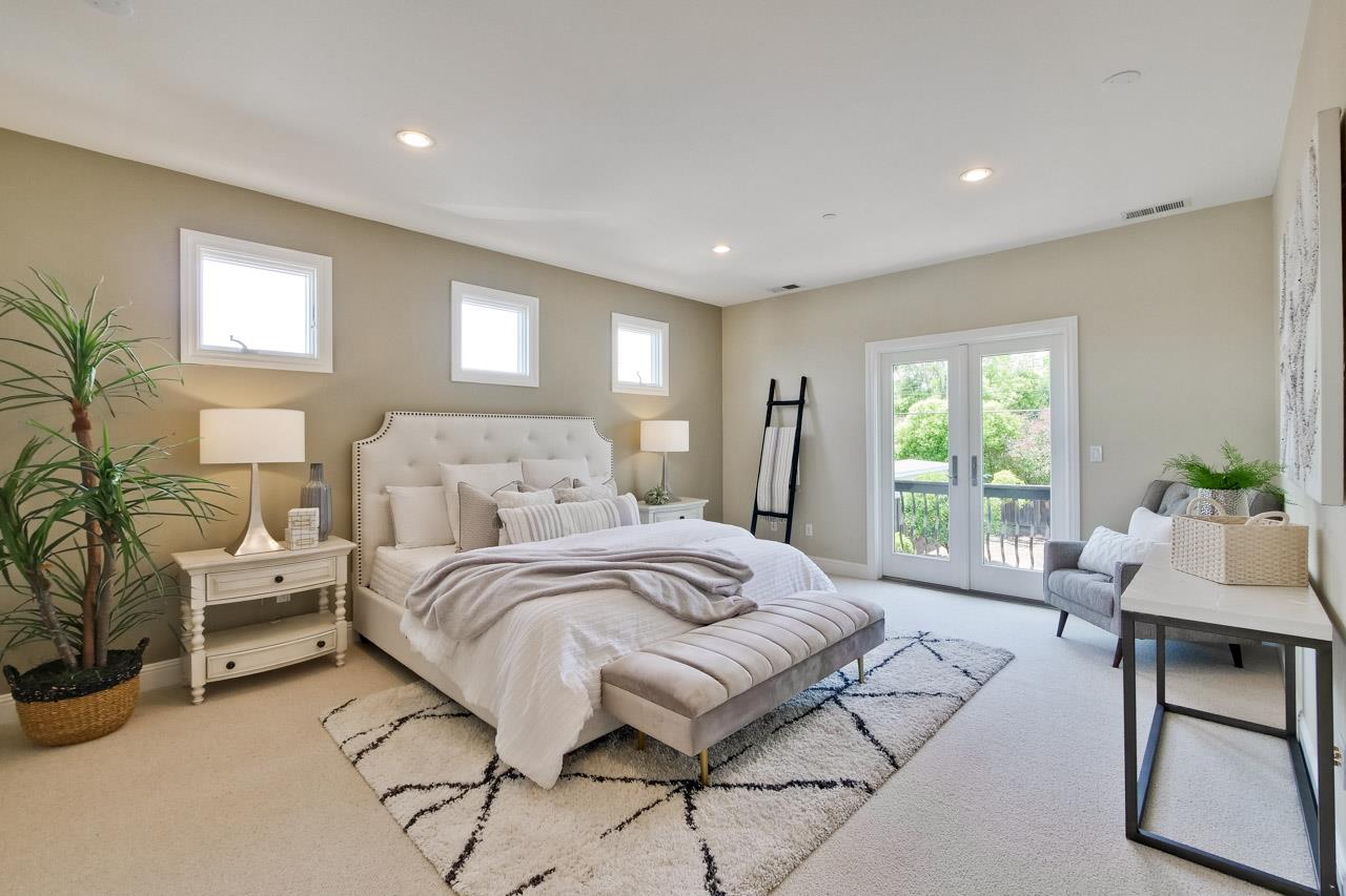 1663 Samedra Street Sunnyvale, CA 94087 - Photo 57 of 79 a spacious bedroom with a large bed and a couch