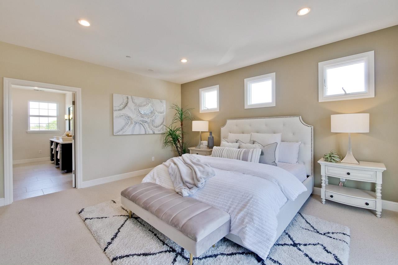 1663 Samedra Street Sunnyvale, CA 94087 - Photo 58 of 79 a spacious bedroom with a bed and a couch