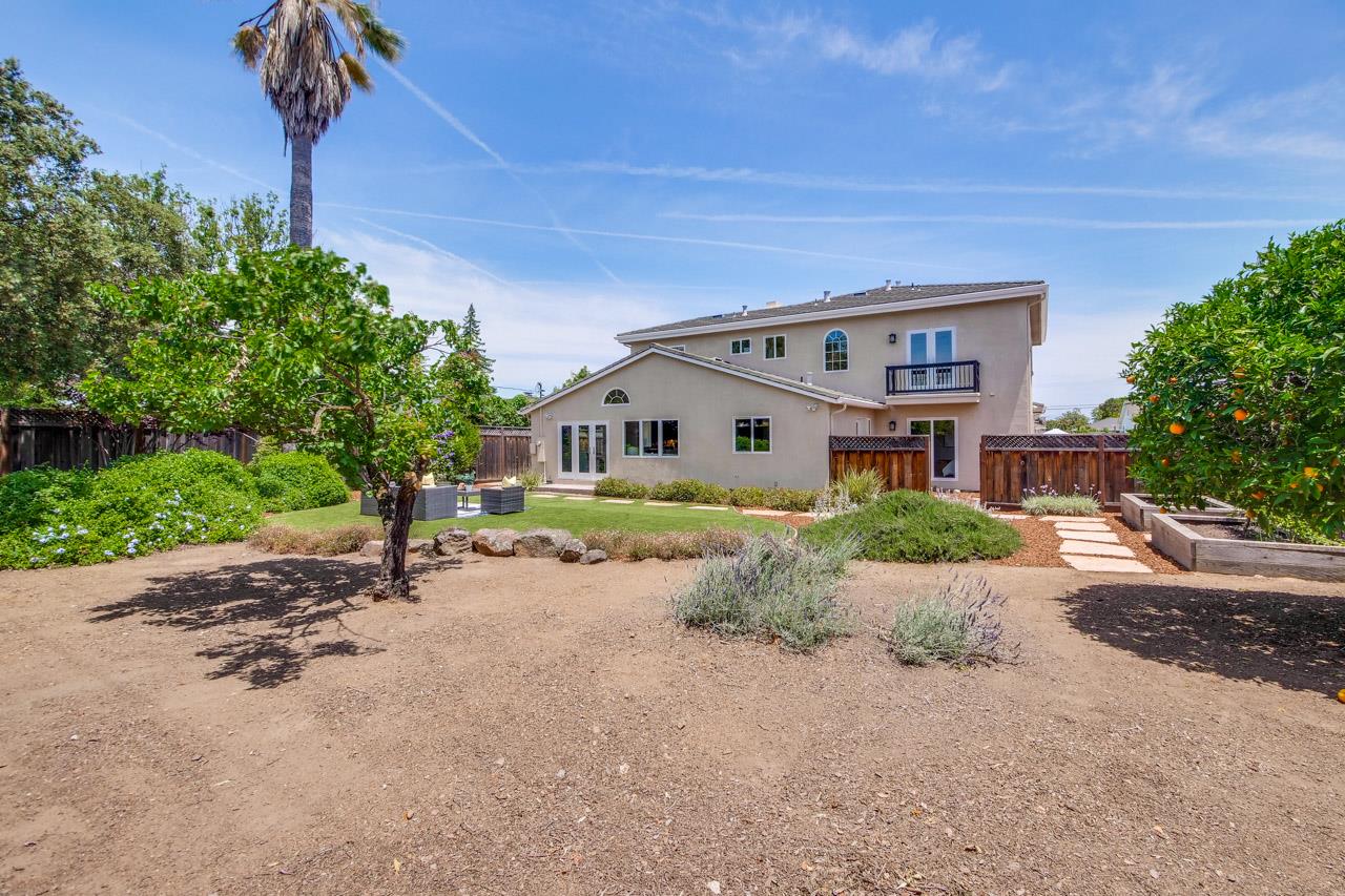 1663 Samedra Street Sunnyvale, CA 94087 - Photo 67 of 79 a front view of a house with a yard and garage