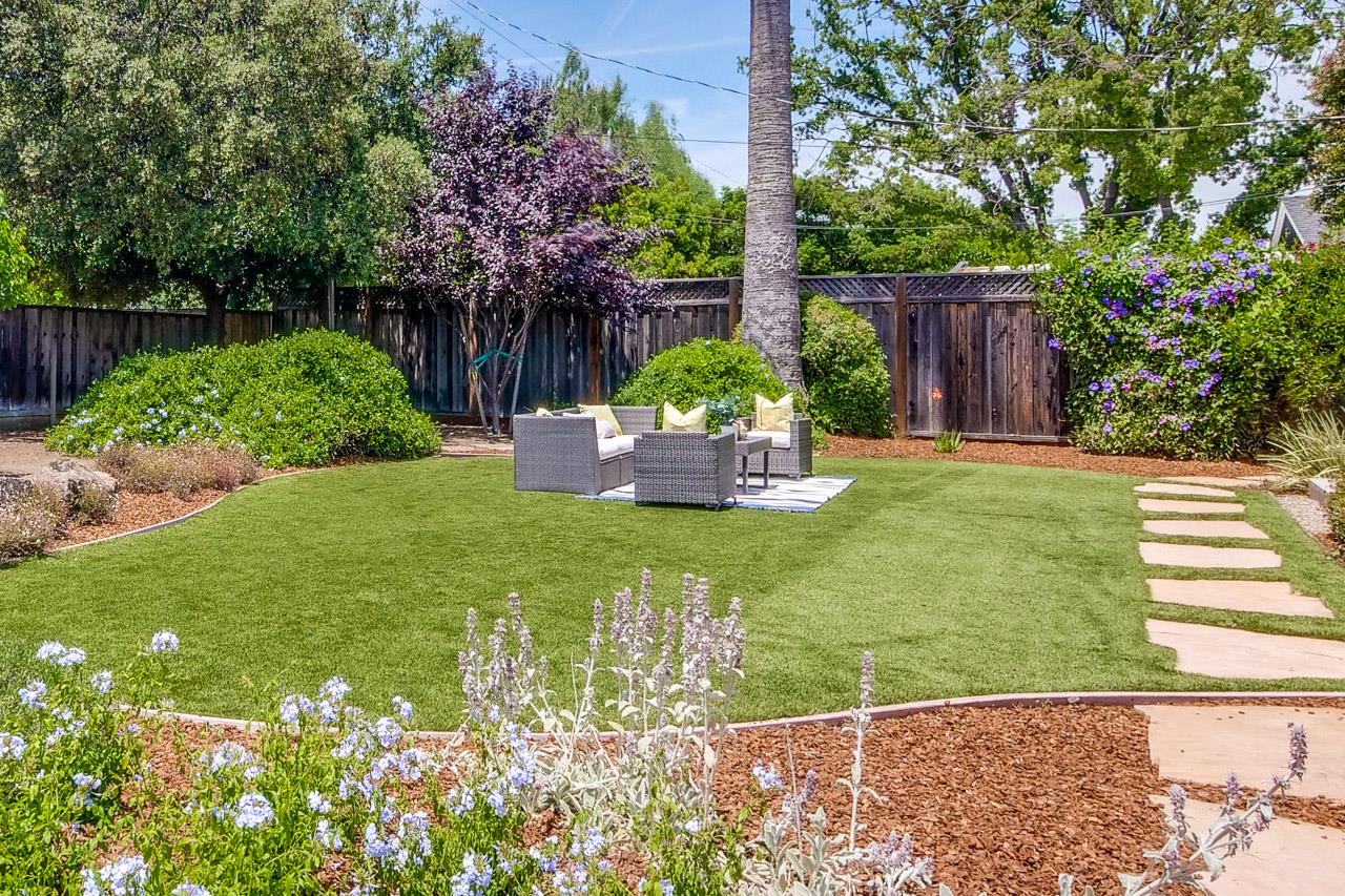 1663 Samedra Street Sunnyvale, CA 94087 - Photo 68 of 79 a view of a backyard with table and chairs potted plants and large tree