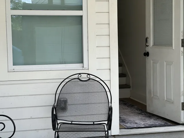 a view of staircase with a rug