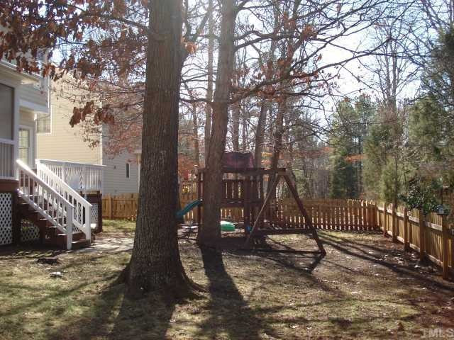 8829 Breeland Way Raleigh, NC 27613 - Photo 12 of 12 Great backyard with patio, deck & enclosed porch! Completely fenced in too!