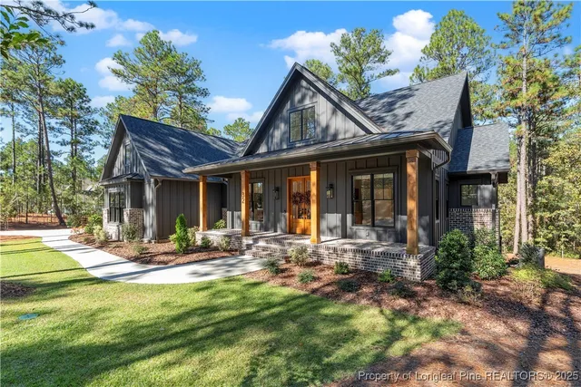 a backyard of a house with outdoor seating