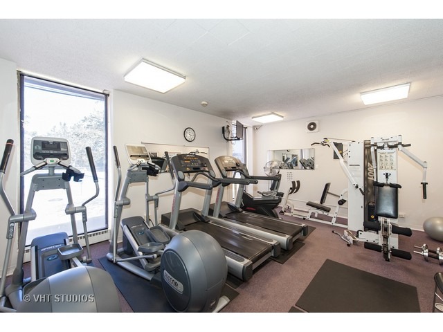 5701 North Sheridan Road, Unit 6T Chicago, IL 60660 - Photo 14 of 15 a view of a room with gym equipment